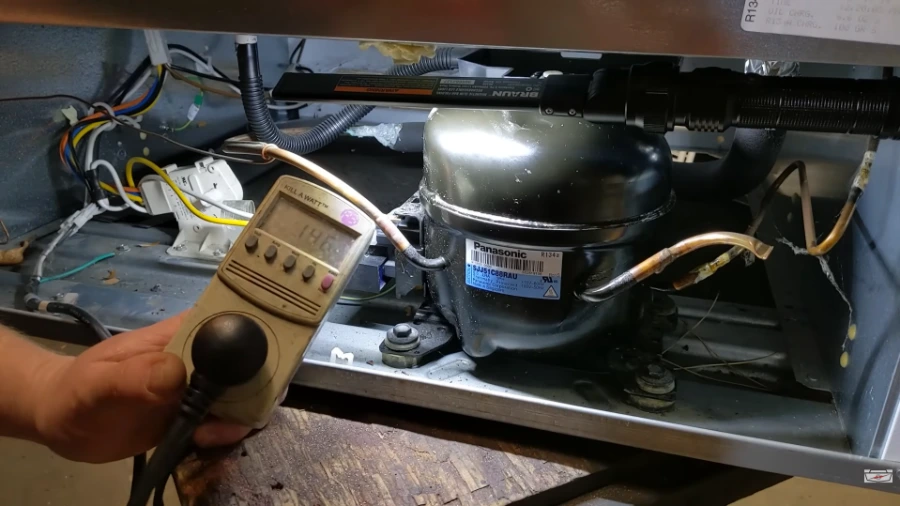 Power consumption test on a refrigerator compressor to detect sealed system problems