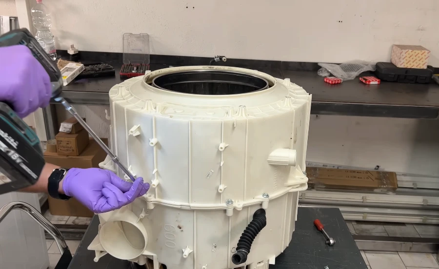 Washer drum repair inspecting basket and suspension