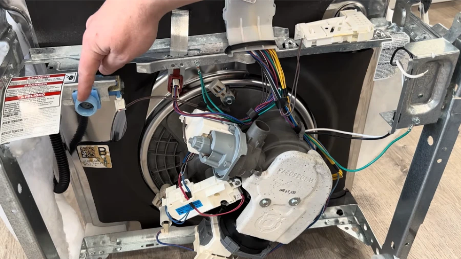 Accessing the dishwasher drain pump assembly from beneath the unit for impeller inspection