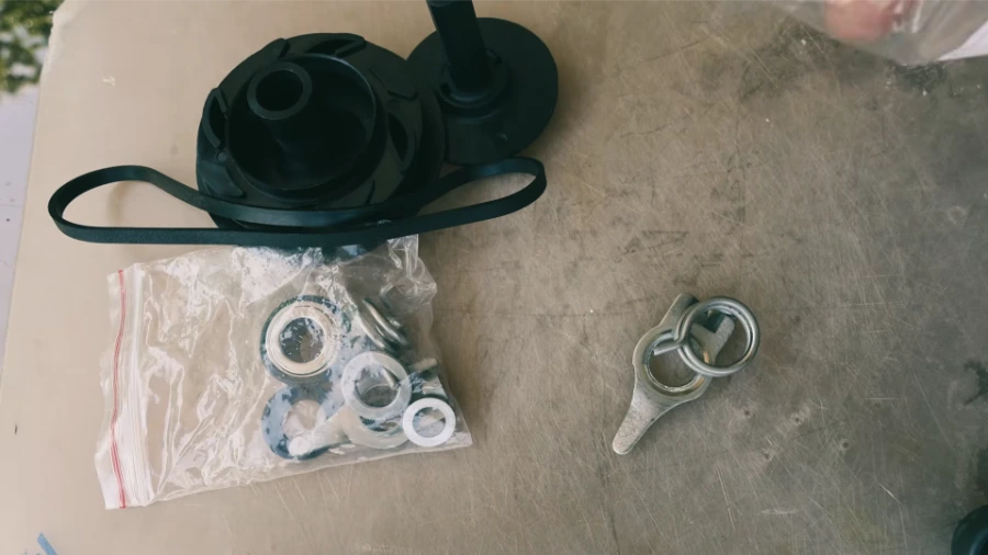 Replacement dishwasher drain pump and wash impeller kit showing both components