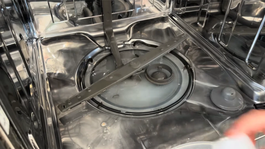 Dishwasher filter assembly and sump area showing coarse and fine filter components
