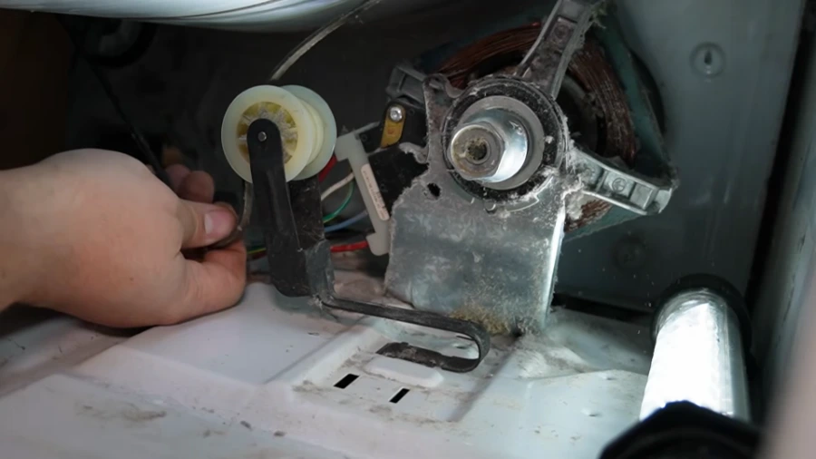 Dryer belt routed around the idler pulley and motor shaft
