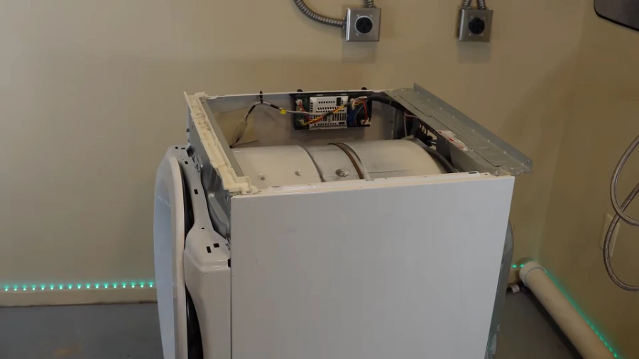Dryer repair technician working on a residential dryer in Concord NC