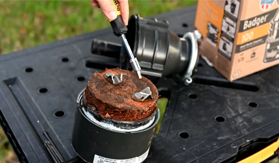 Garbage disposal showing corrosion and internal damage indicating replacement may be needed