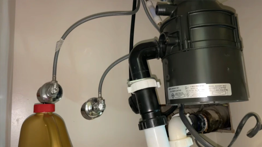 Garbage disposal installation and replacement service under kitchen sink