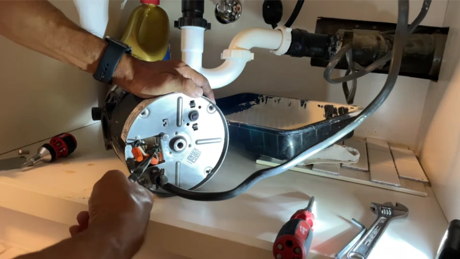 Garbage disposal motor and mechanical components during repair
